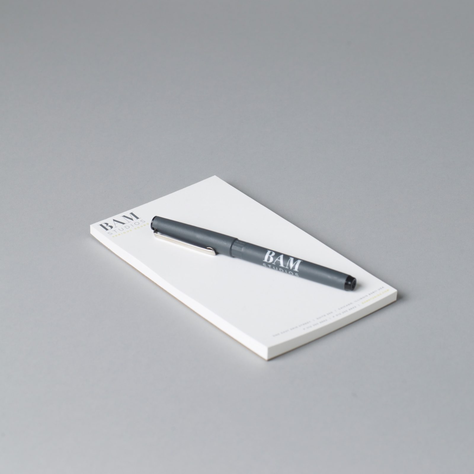 A BAM Studios notepad and pen