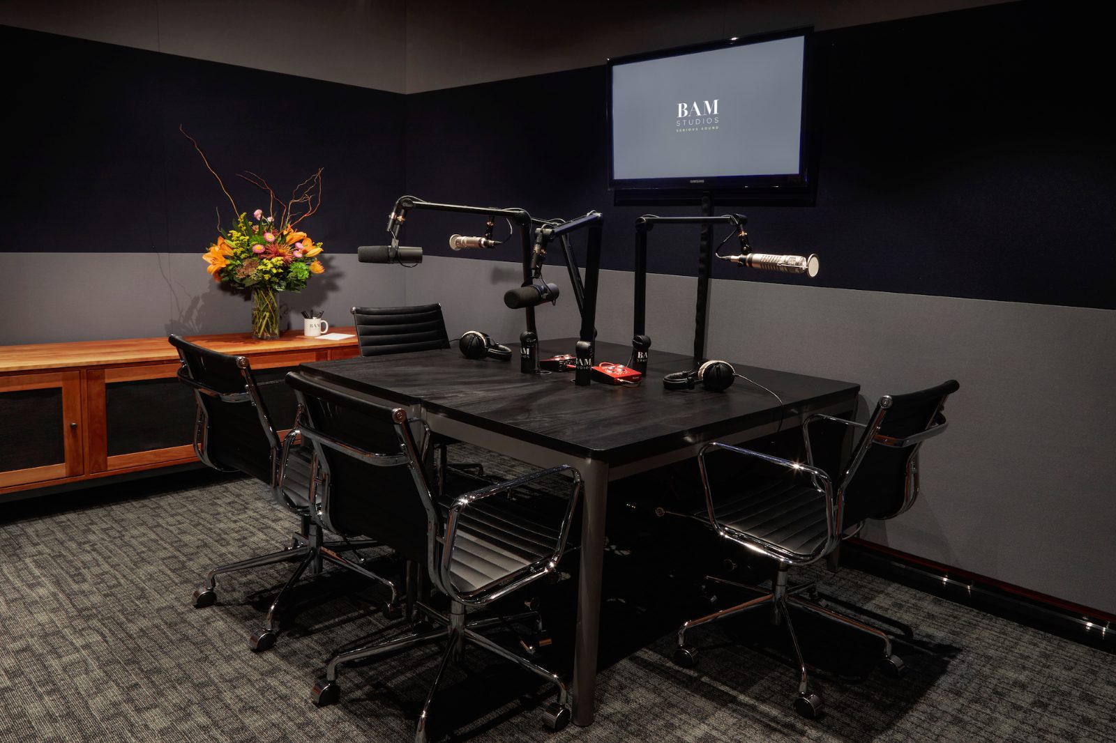The Podcast Studio at BAM HQ — four mic positions around the table